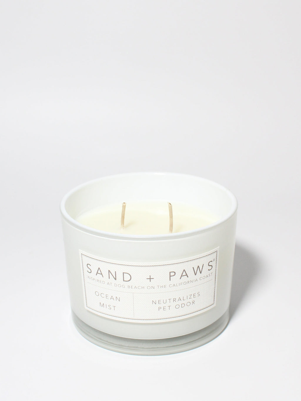 Sand + Paws Ocean Mist 12 oz scented candle White vessel with Carved Paw Print lid