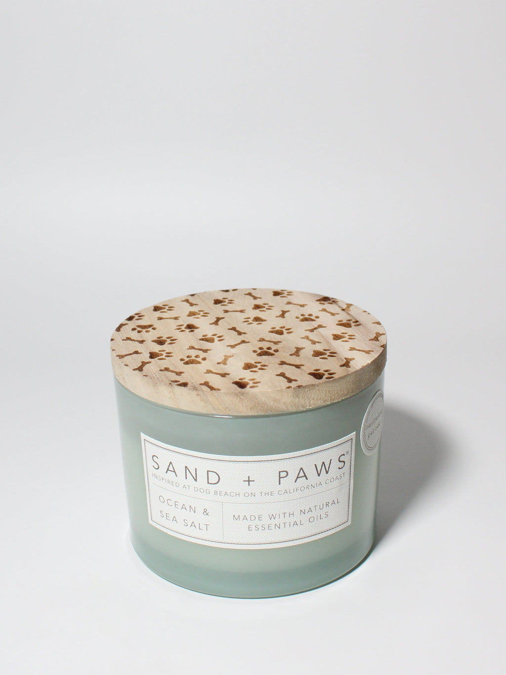 Sand + Paws Ocean & Sea Salt 12 oz scented candle Seaglass vessel with Carved Paws and Bones lid