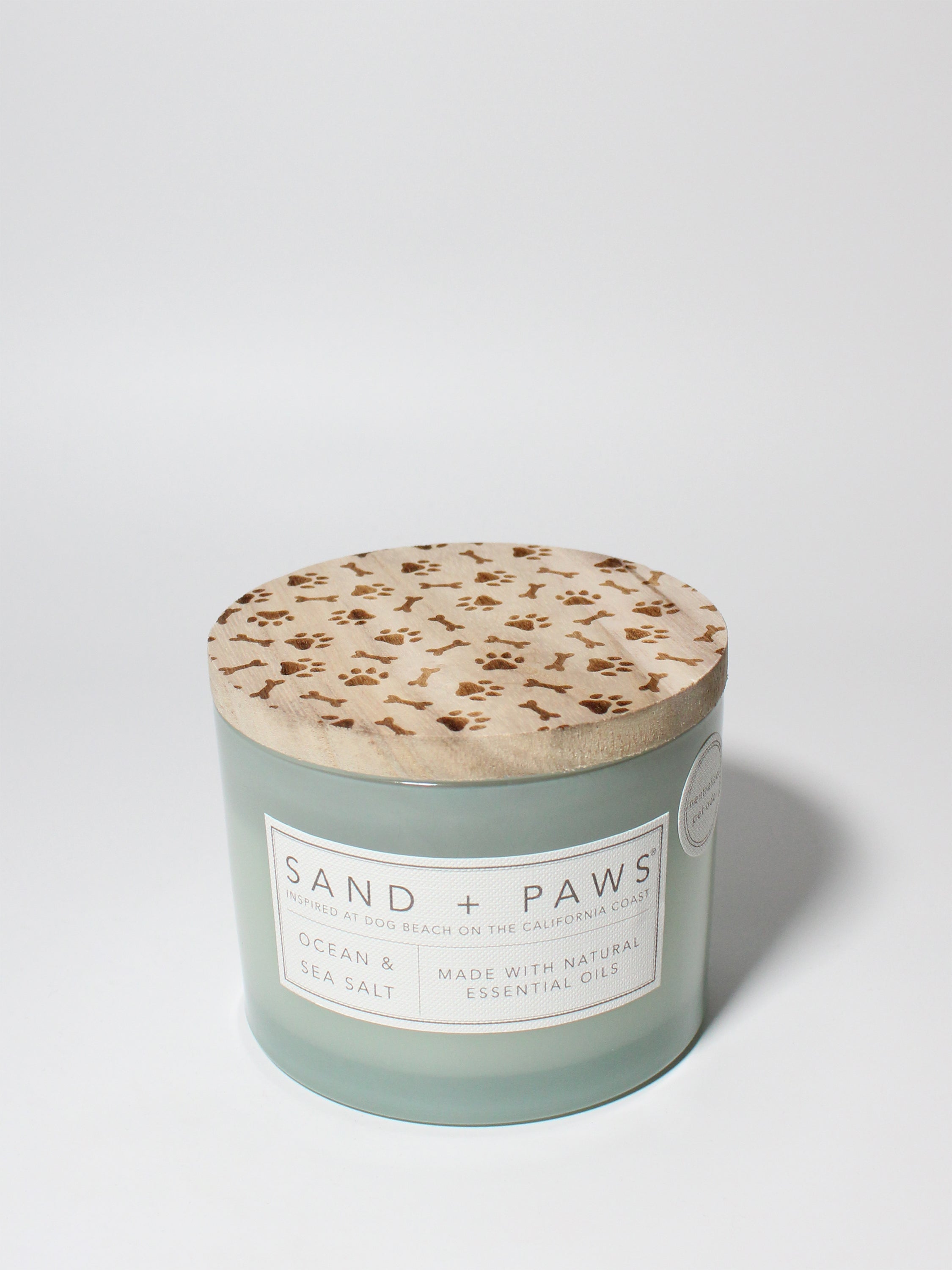 Sand + Paws Ocean & Sea Salt 12 oz scented candle Seaglass vessel with Carved Paws and Bones lid