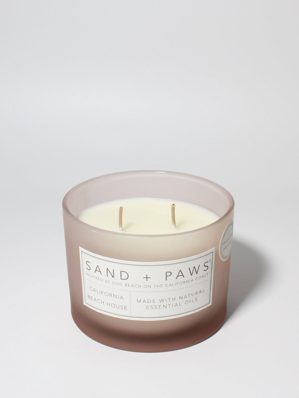 Sand + Paws California Beach House 12 oz scented candle Blush vessel with Painted Paw Grid lid