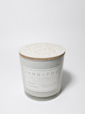 Mango Tangerine 21 oz candle with a wood lid